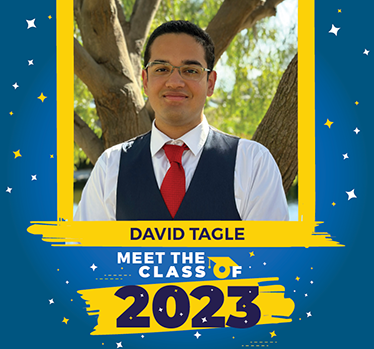 Meet the Class of 2023: David Tagle. David wearing vest and tie stands in front of tree on a bright sunny day