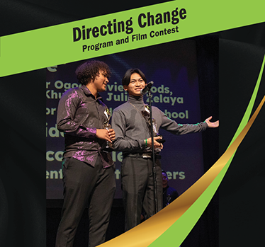 Directing Change Program and Film Contest. Two high school students speaking on stage.
