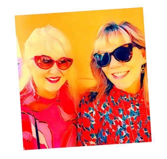 Louisa Higgins and Karen Riley smiling wearing bright colors and big sunglasses