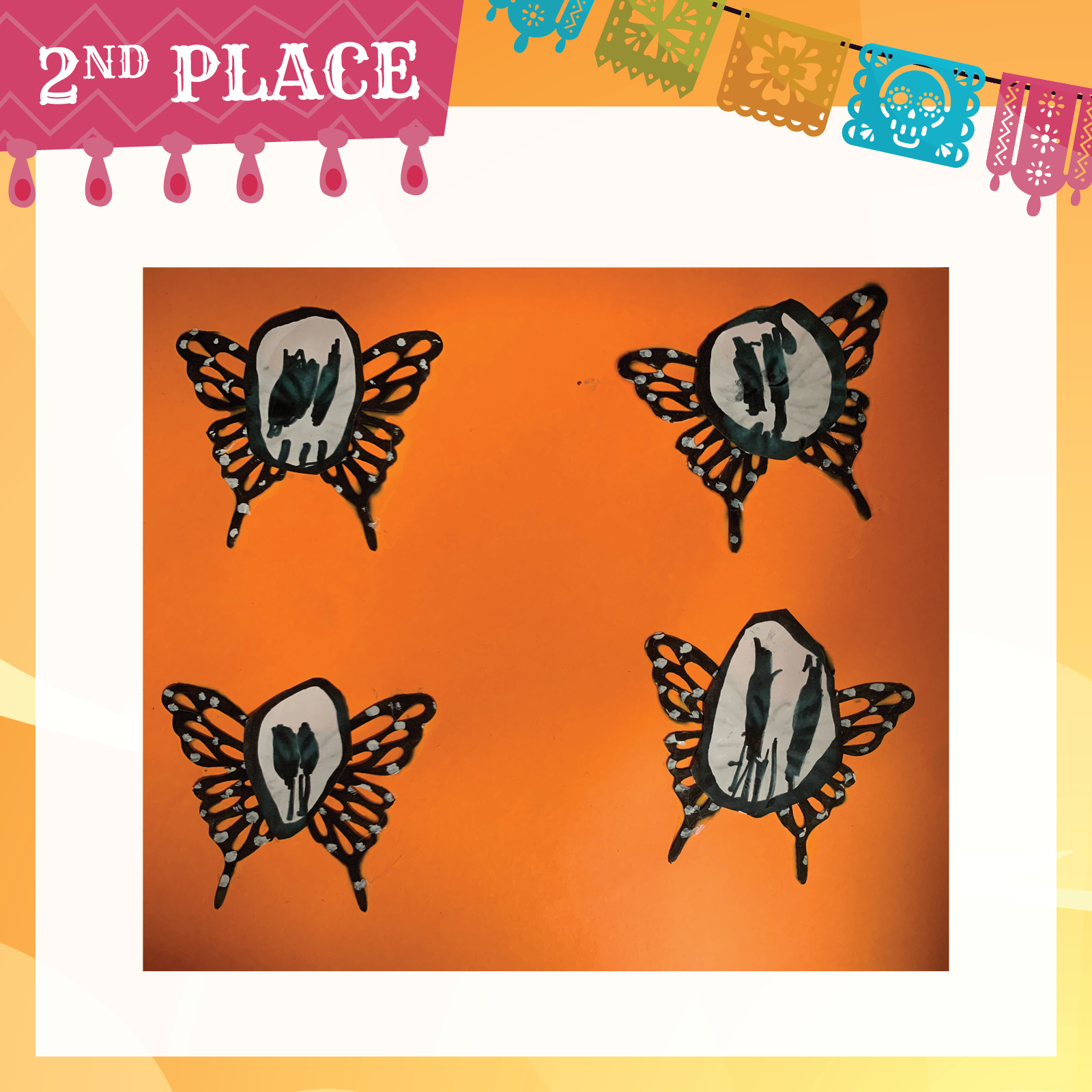 Drawing of 4 black butterflies with skeleton faces on orange paper