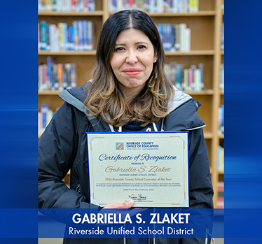 Gabriella S. Zlaket holding School Counselor of the Year certificate. Riverside Unified School District