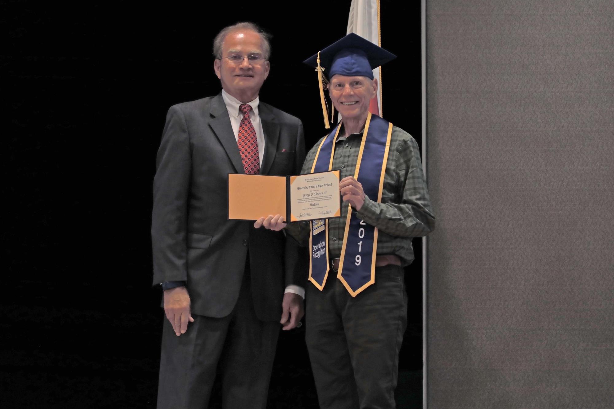 George Flowers receives his diploma