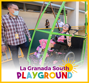 Student and teacher enjoy La Granada South Inclusive Playground