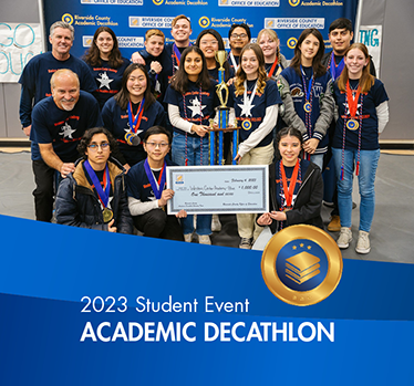 2023 Student Events. Academic Decathlon winning team poses wear medals and holding oversized check.