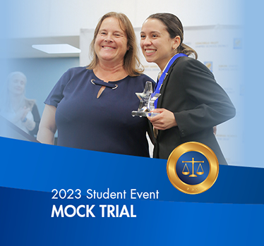 2023 Student Events. Mock Trial. Student holding trophy smiling with female lawyer.
